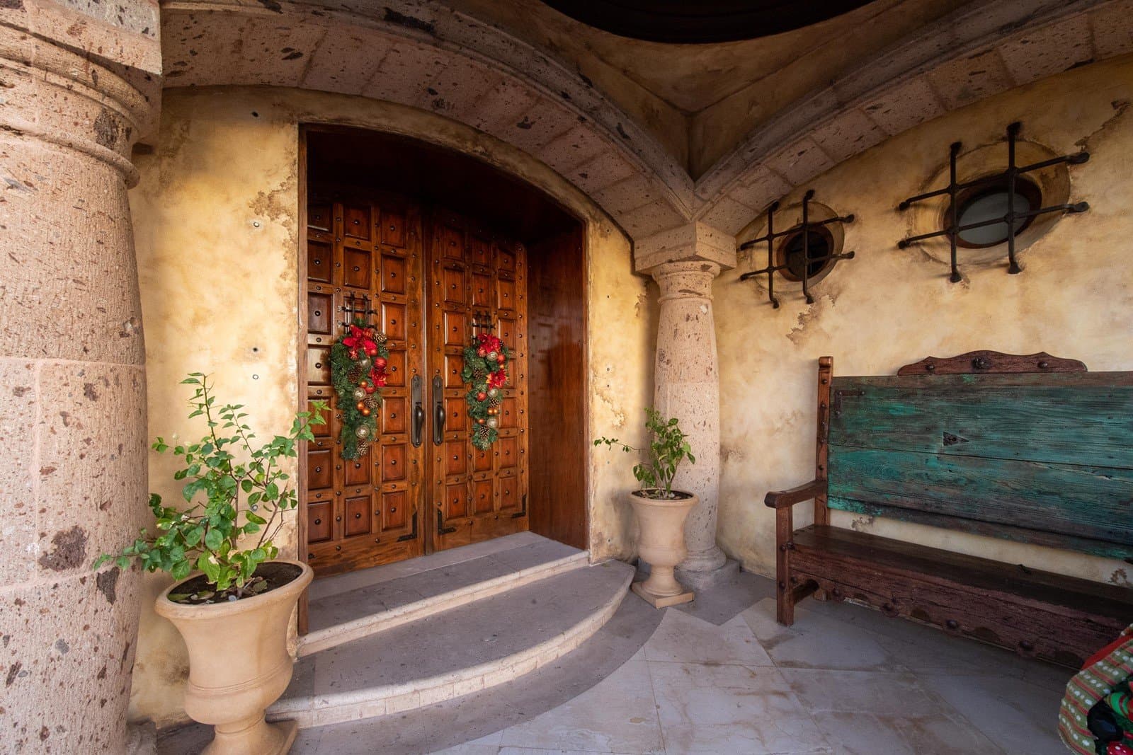 The main front wooden double doors of the villa.