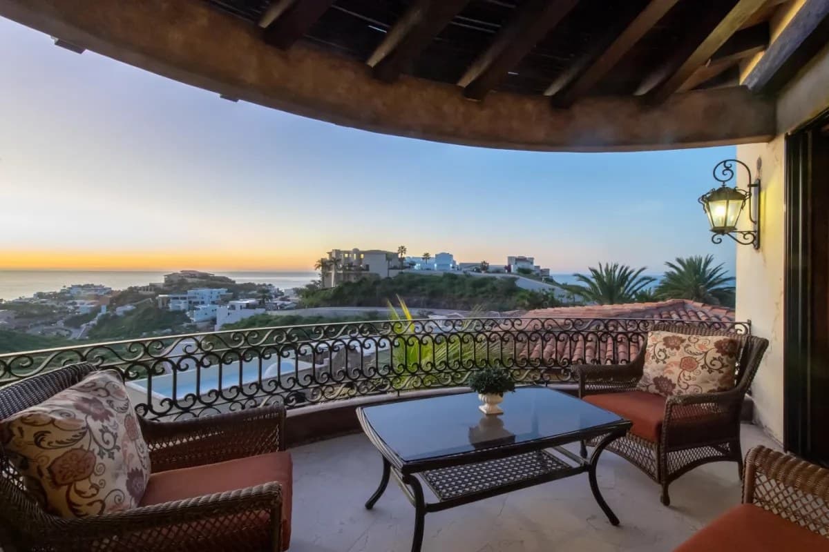 Picture yourself relaxing here as the sun sets, painting the sky in warm hues. This charming terrace offers sweeping ocean and hillside views, perfect for your morning coffee or evening unwind.