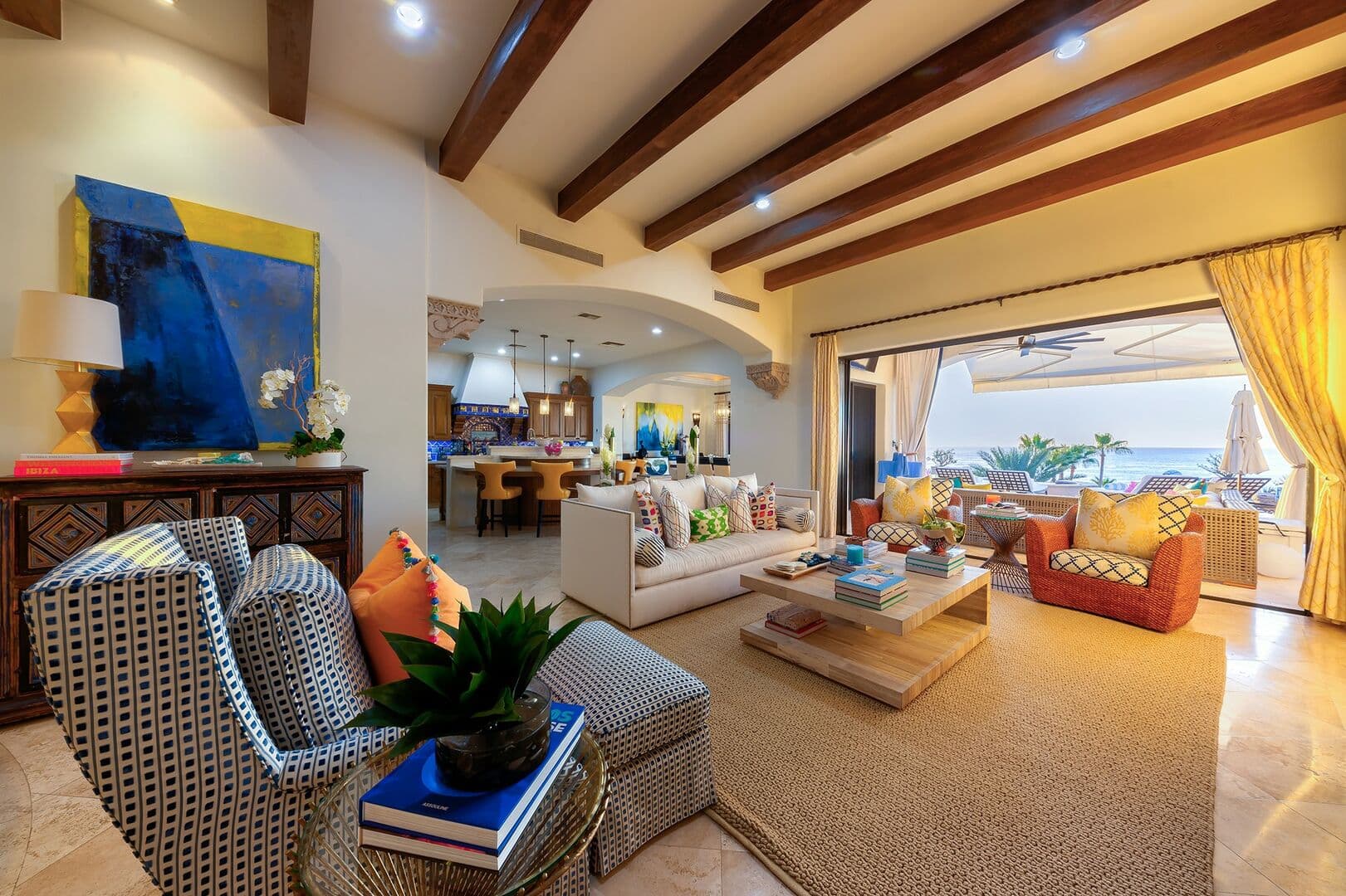 Exposed wooden beams in the seating area next to the dining room table.