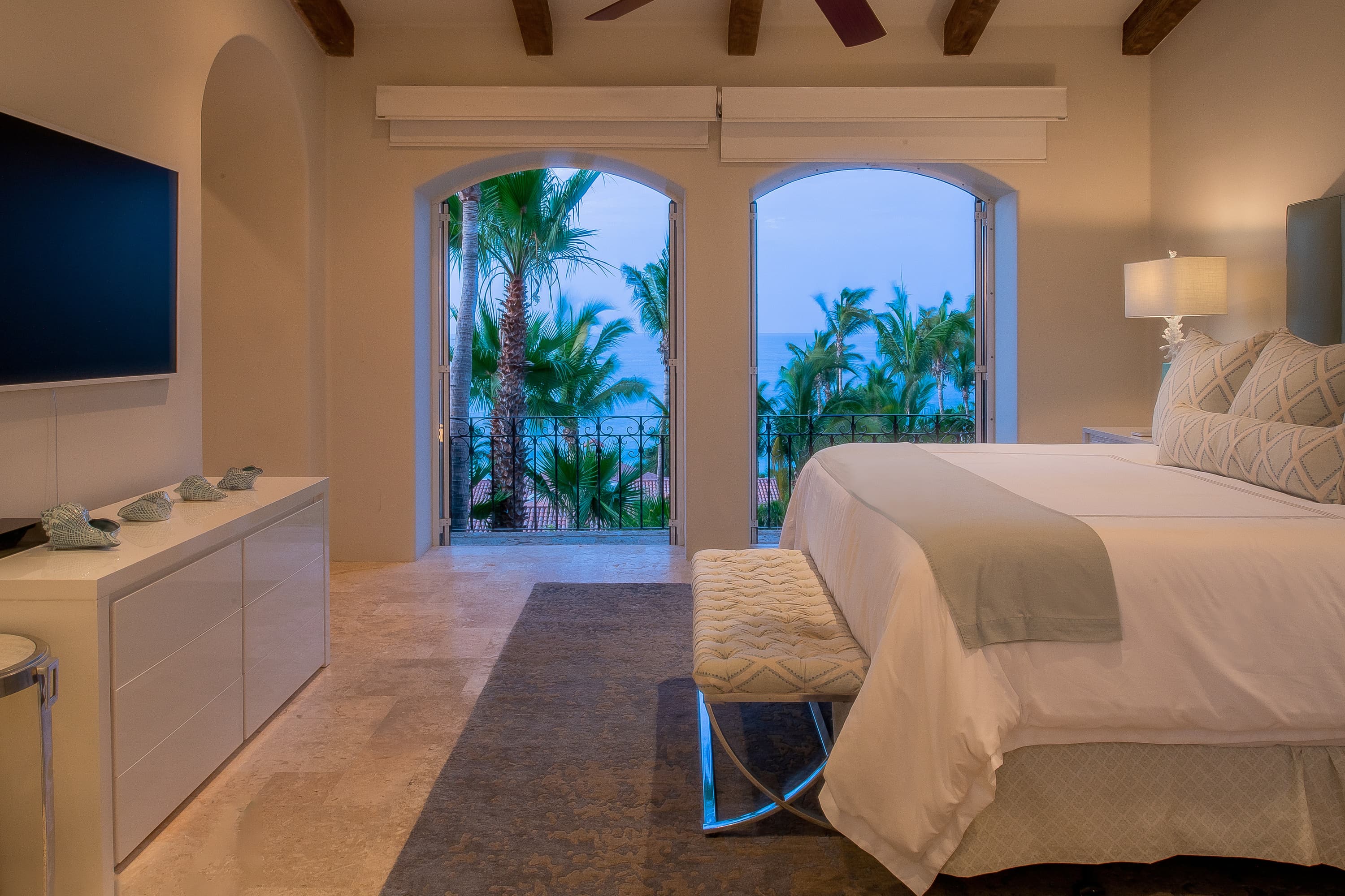 One of the bedrooms in Casita 6, faces a wall-mounted TV.
