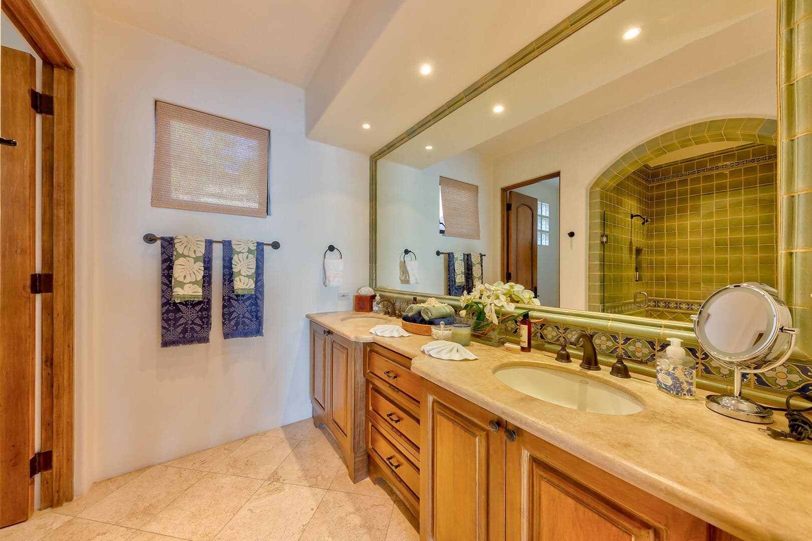 Large bathroom number one with a large mirror and double vanity.