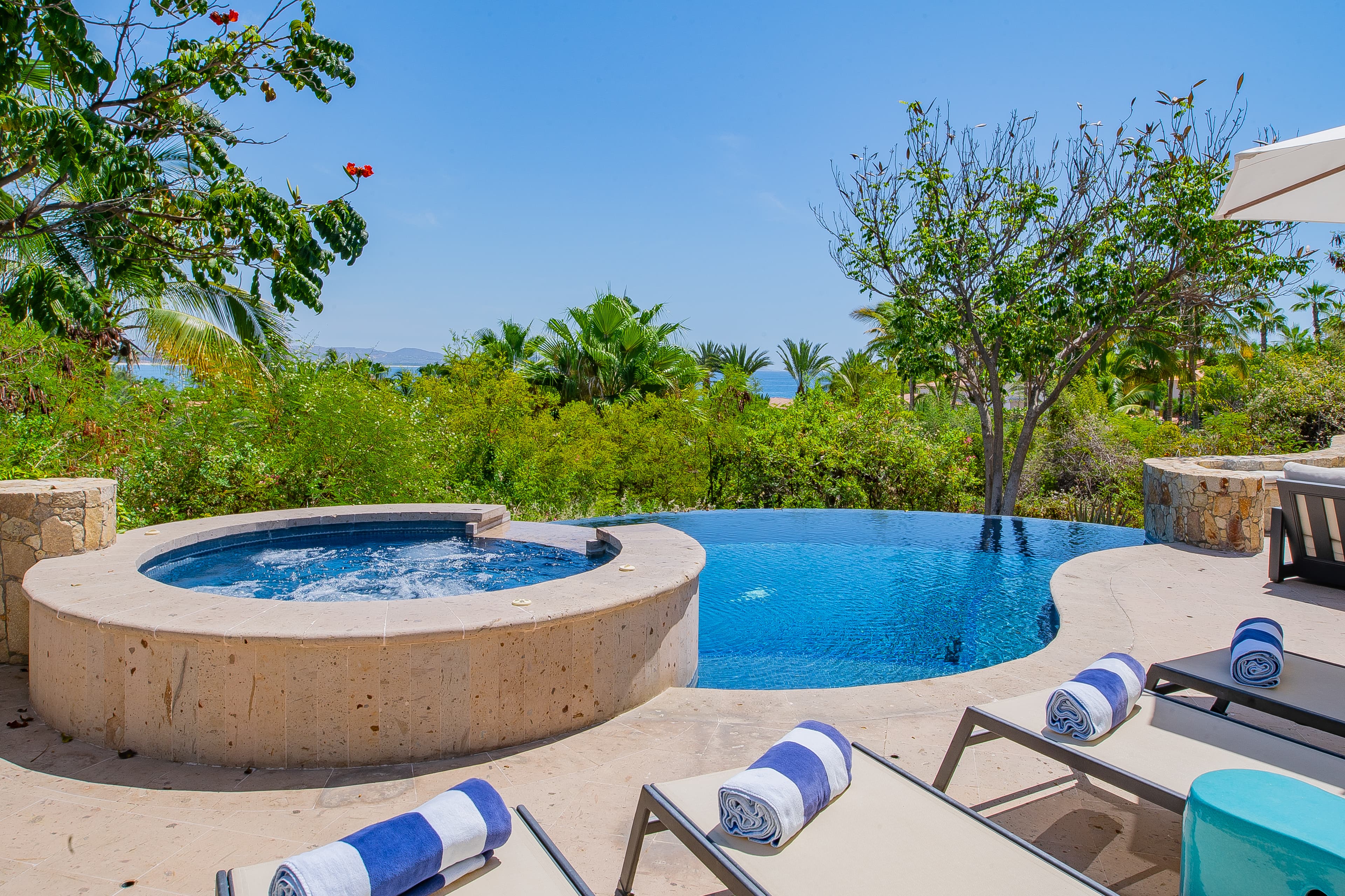Take a refreshing dip in your private infinity pool or soak in the bubbling hot tub while gazing at lush tropical greenery and sparkling ocean views.